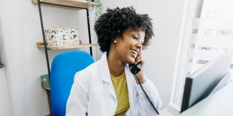 Smiling healthcare worker speaking on the phone